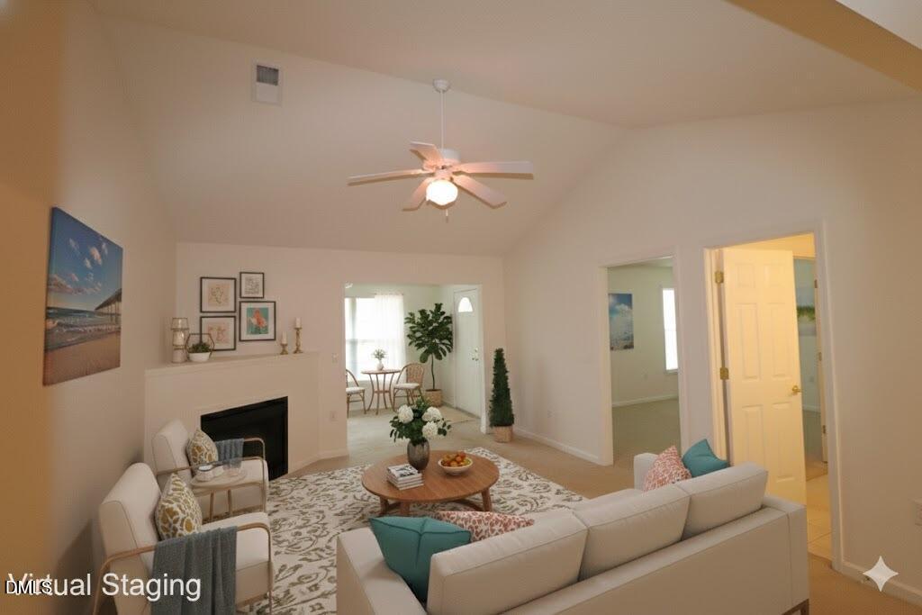 a living room with furniture and a fireplace