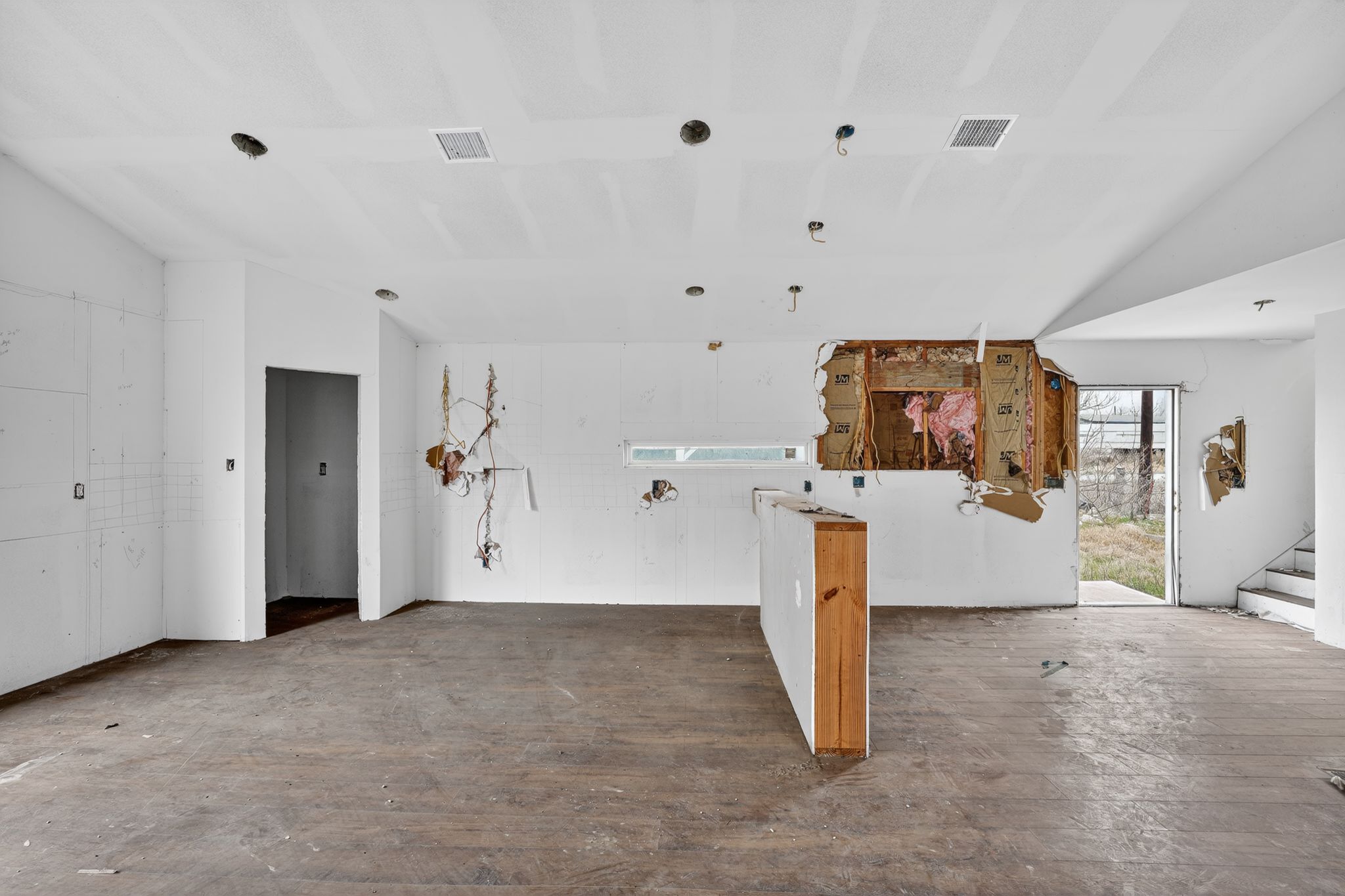 11223 Tom Sassman Road Austin, TX 78747 - Photo 35 of 40 Unfurnished living room with wood-type flooring