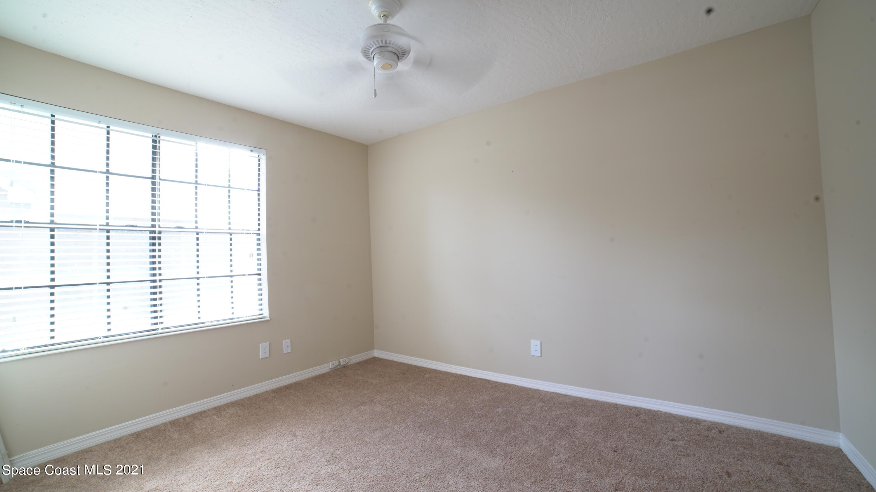 7667 North Wickham Road, Unit 1309 Melbourne, FL 32940 - Photo 12 of 18 an empty room with a window