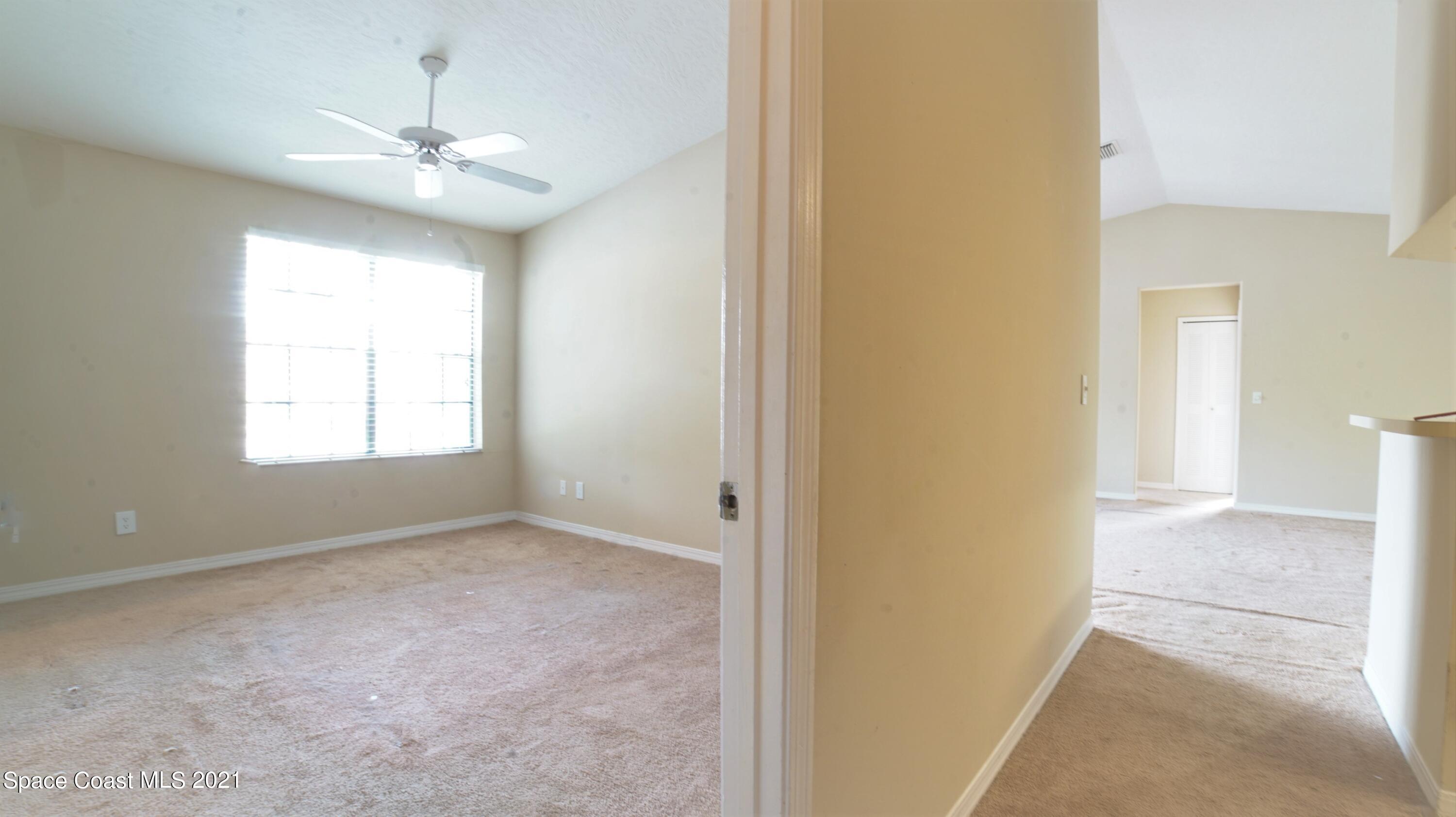 7667 North Wickham Road, Unit 1309 Melbourne, FL 32940 - Photo 10 of 18 a view of an empty room with a window