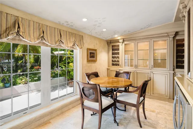 a living room with furniture a large window and a table
