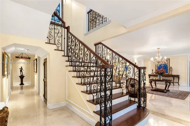 a view of a swimming pool with lawn chairs and a fire pit
