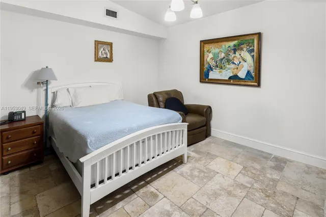 a front view of multiple houses with yard