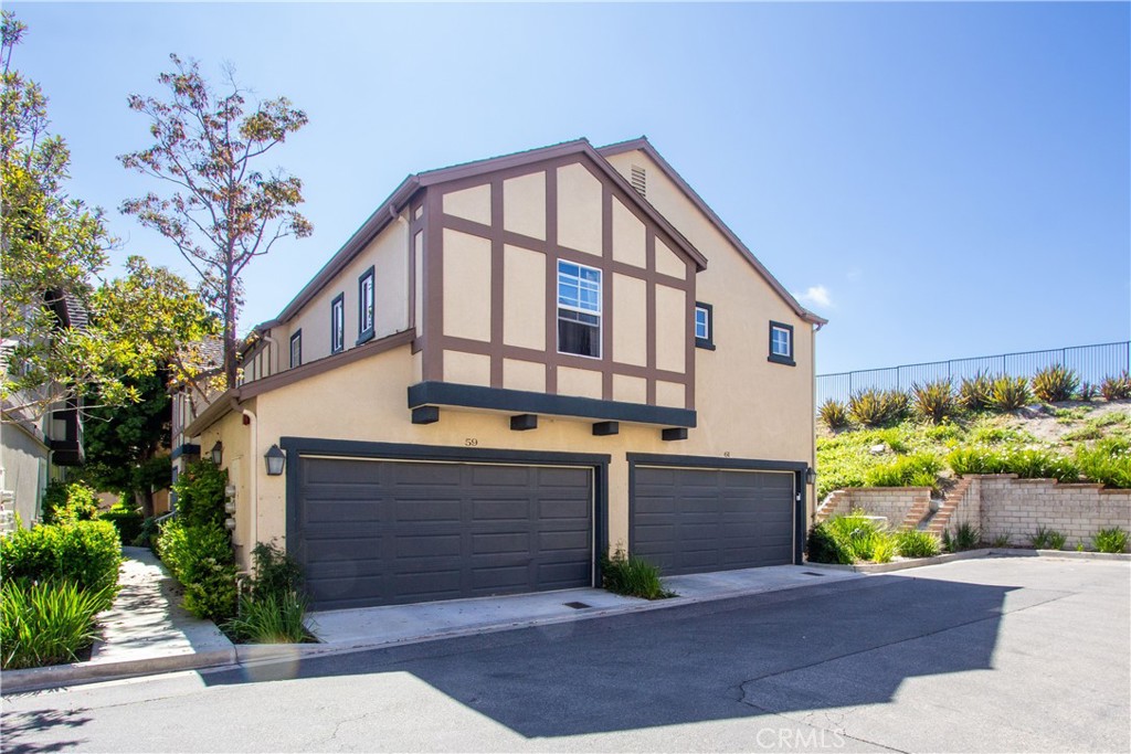 59 Three Vines Court Ladera Ranch, CA 92694 - Photo 1 of 1 a front view of a house with a yard