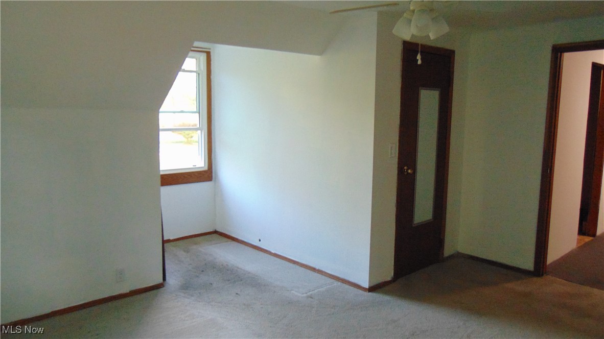 4970 Bryenton Road Litchfield, OH 44253 - Photo 23 of 33 Bonus room with carpet, vaulted ceiling, and ceiling fan