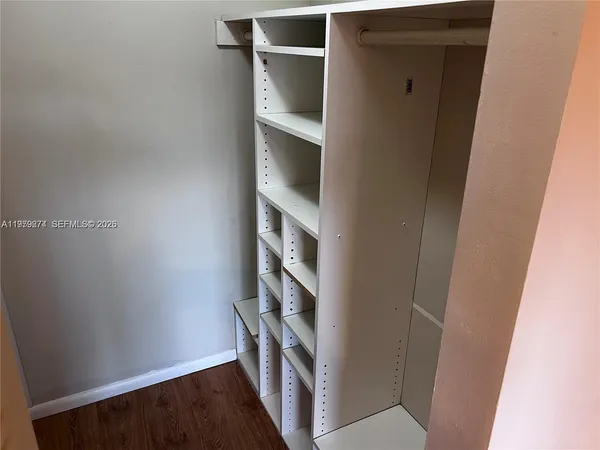 a view of an empty walk in closet