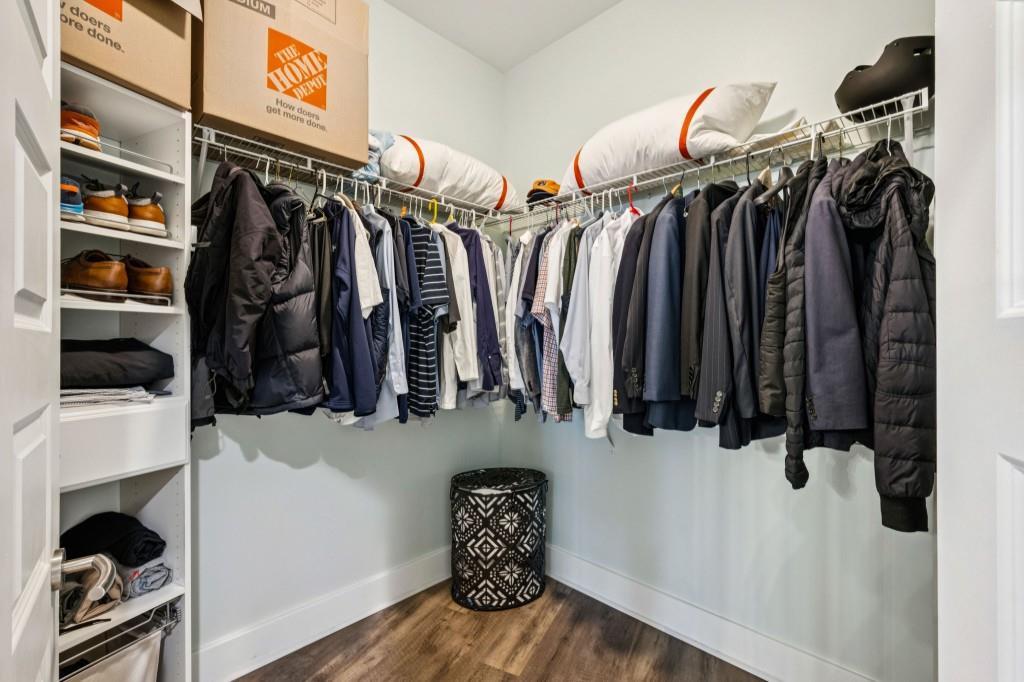 1080 Peachtree Street Northeast, Unit 1012 Atlanta, GA 30309 - Photo 22 of 46 a view of walk in closet with clothes and shoes