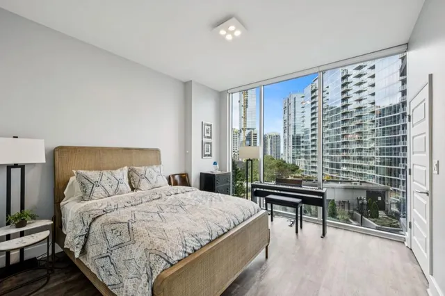 a bed room with a bed and a lamp