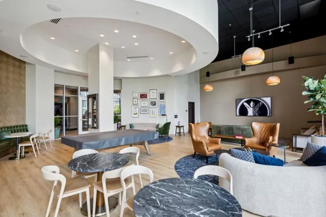 a living room with furniture and a rug