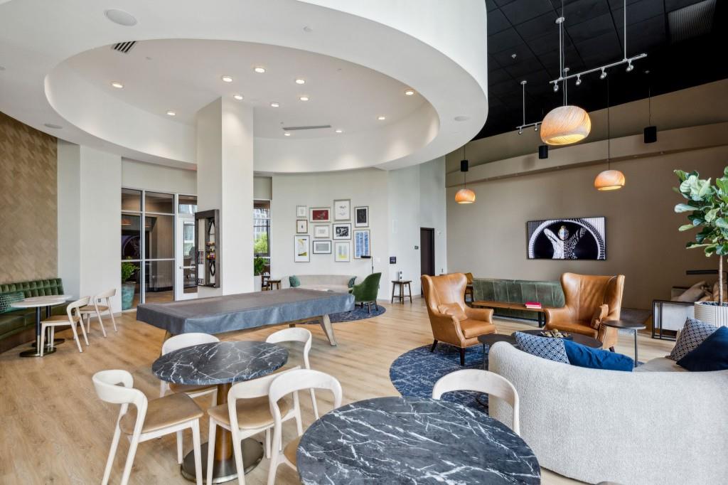 1080 Peachtree Street Northeast, Unit 1012 Atlanta, GA 30309 - Photo 34 of 46 a living room with furniture and wooden floor