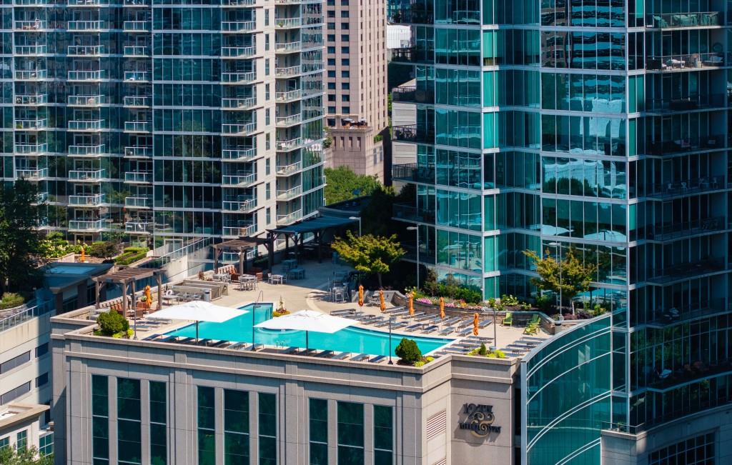 1080 Peachtree Street Northeast, Unit 1012 Atlanta, GA 30309 - Photo 6 of 46 a room with lots of flowers and a glass door