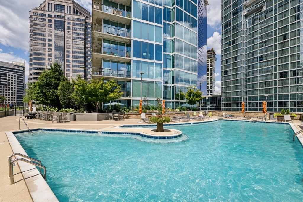 1080 Peachtree Street Northeast, Unit 1012 Atlanta, GA 30309 - Photo 7 of 46 a view of a swimming pool with a patio