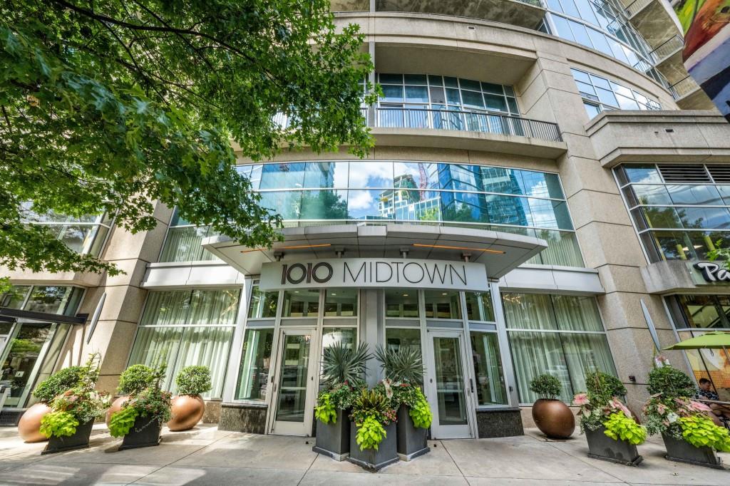 1080 Peachtree Street Northeast, Unit 1012 Atlanta, GA 30309 - Photo 9 of 46 a front view of a house with a garden