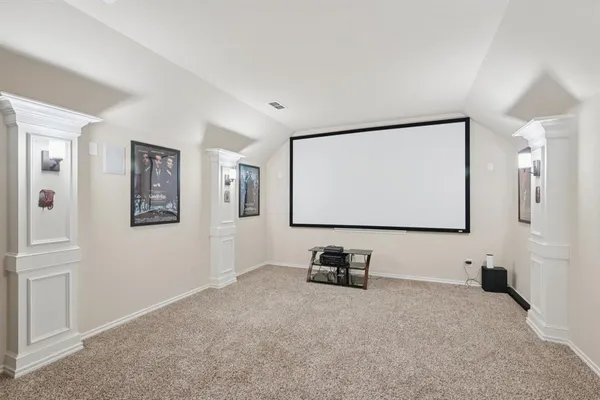 a view of room with windows and projector