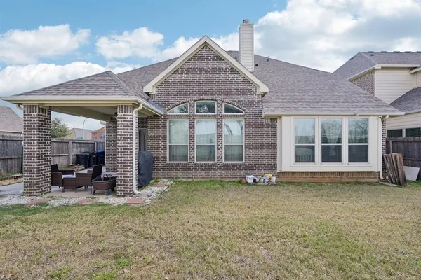 front view of a house with a garden