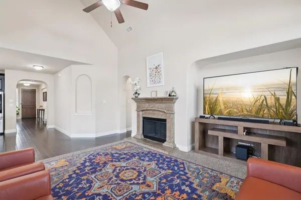 a living room with furniture and a flat screen tv