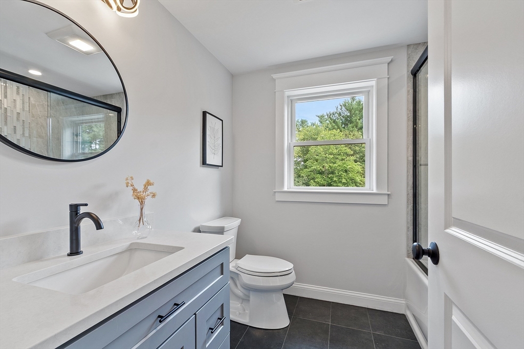 15-2 Park Street, Unit B North Reading, MA 01864 - Photo 18 of 39 a bathroom with a toilet a sink and mirror