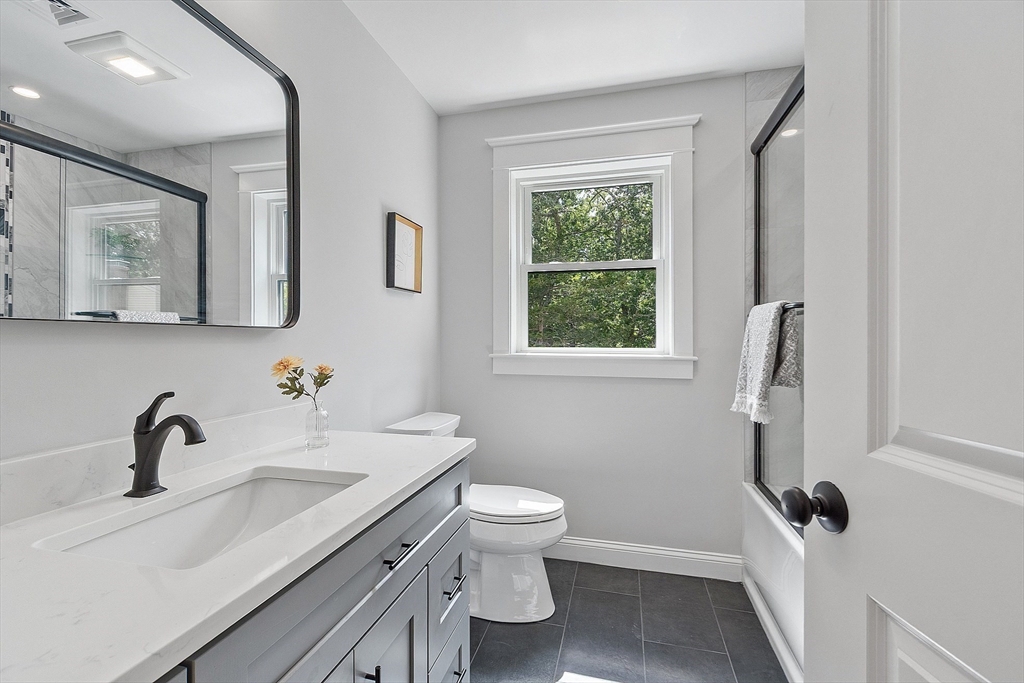 15-2 Park Street, Unit B North Reading, MA 01864 - Photo 23 of 39 a bathroom with a sink and a toilet