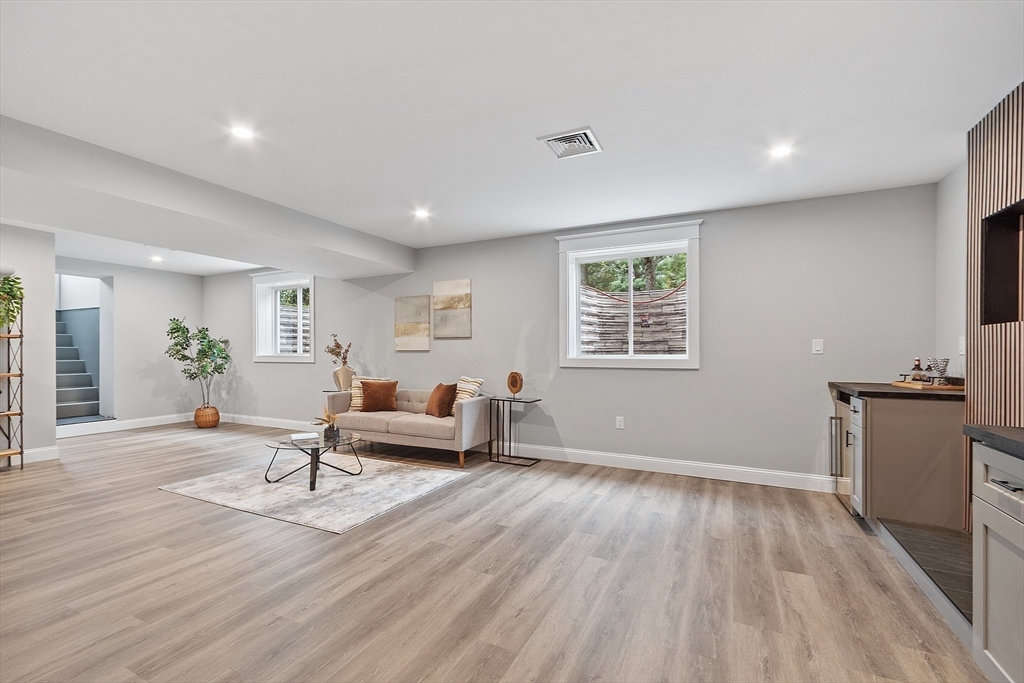 15-2 Park Street, Unit B North Reading, MA 01864 - Photo 26 of 39 a living room with furniture and a wooden floor