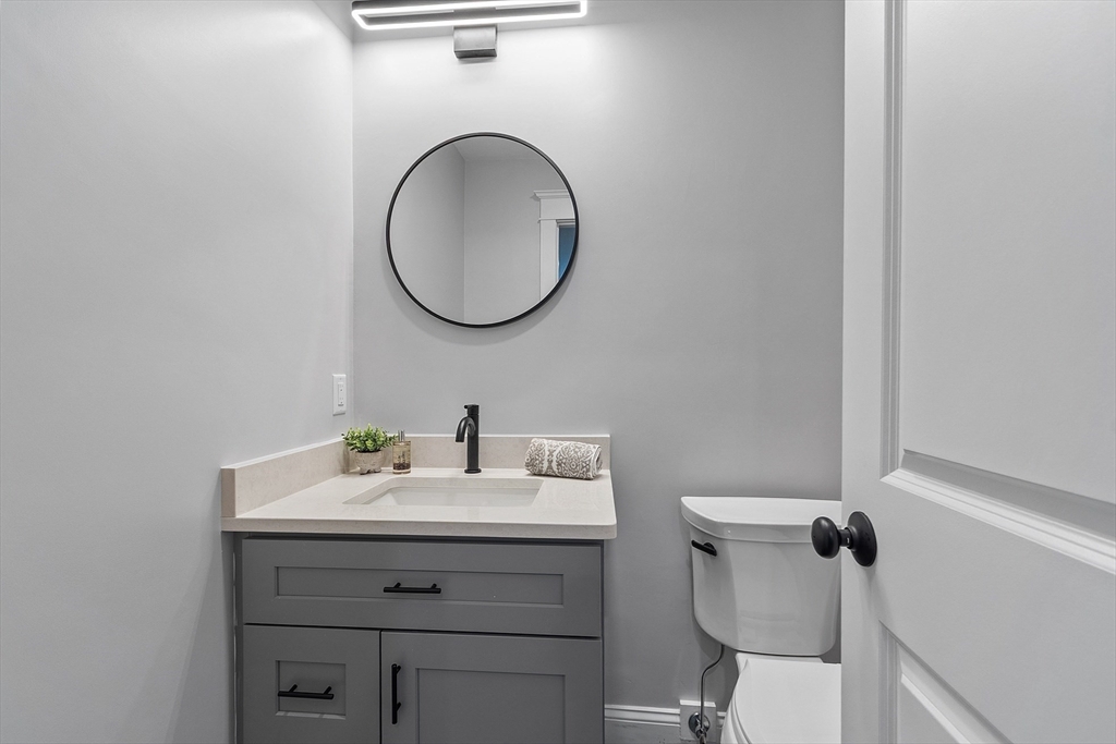 15-2 Park Street, Unit B North Reading, MA 01864 - Photo 28 of 39 a bathroom with a sink and a mirror