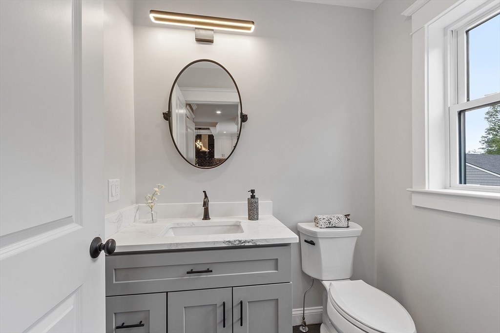 15-2 Park Street, Unit B North Reading, MA 01864 - Photo 10 of 39 a bathroom with a toilet a sink and a mirror