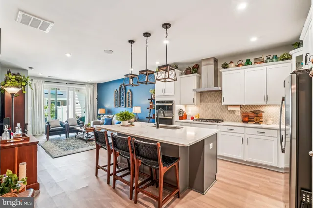 a dining room with furniture and wooden floor