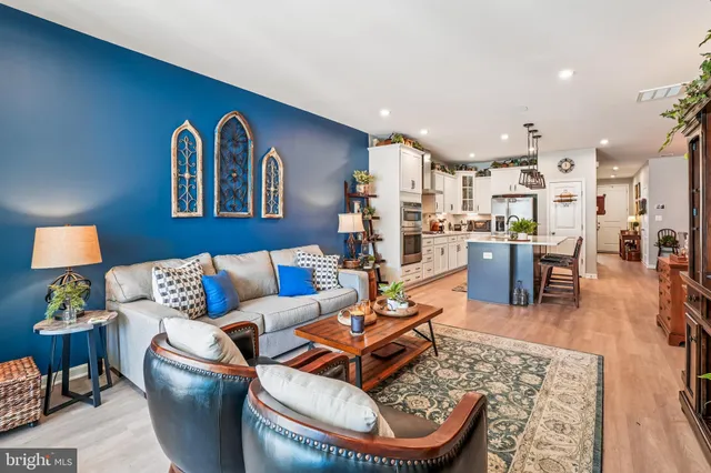 a living room with furniture or couch and a bookshelf