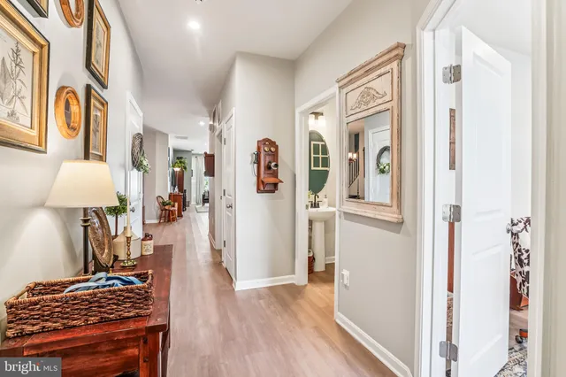 a view of a bedroom with bed and wooden floor