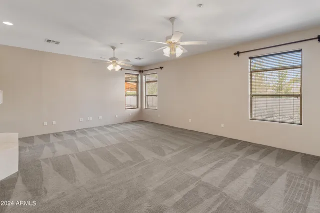 a front view of a house with a yard and outdoor seating