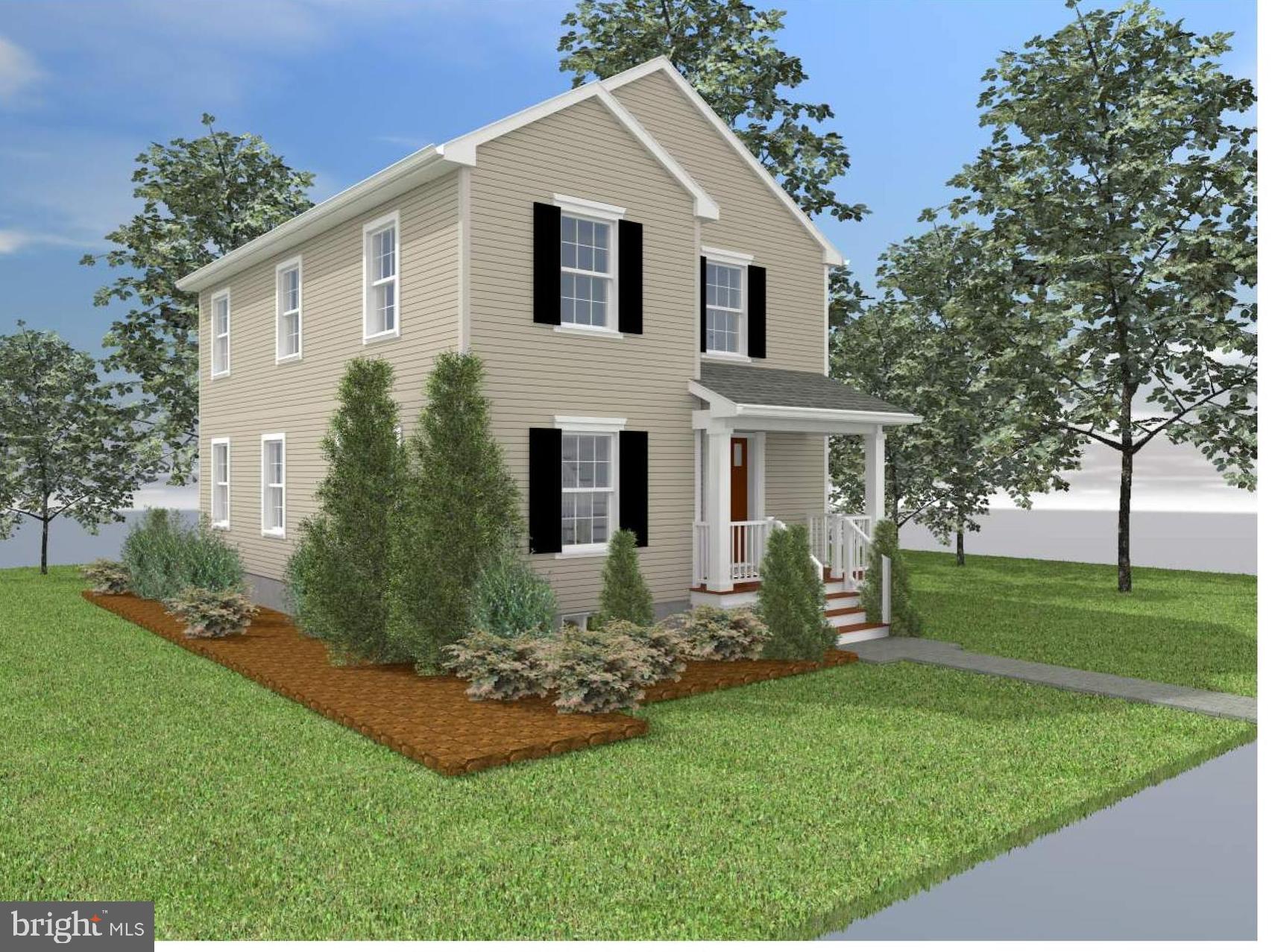 a front view of house with a garden and yard