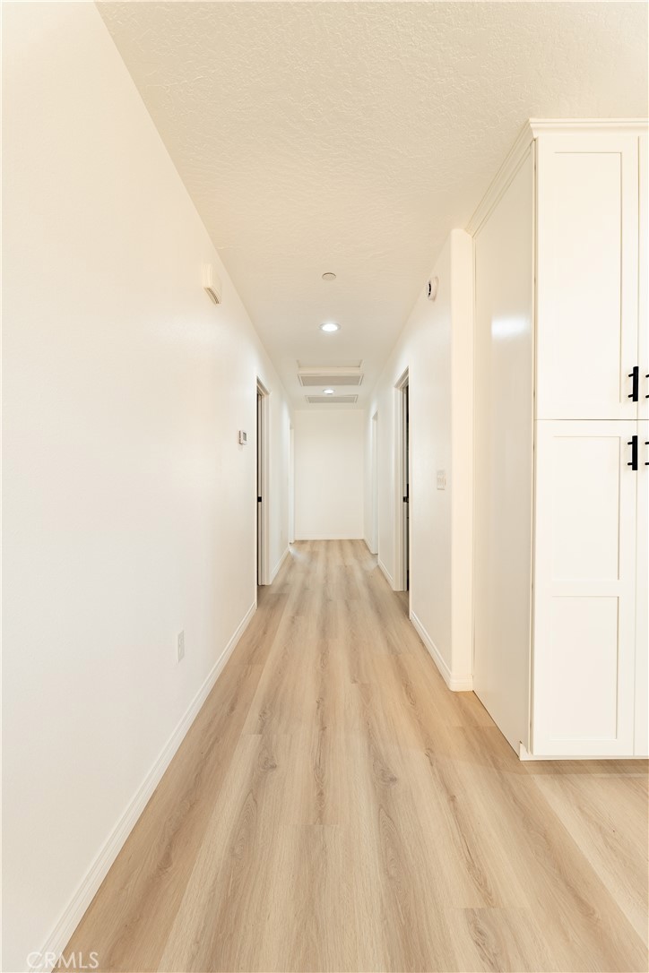 16925 Nanticoke Road Apple Valley, CA 92307 - Photo 40 of 87 a view of a big room with wooden floor and natural light