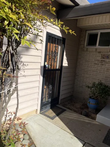 a view of a house with a small yard