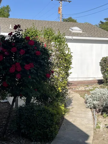 a view of kitchen with granite countertop cabinets and wooden floor