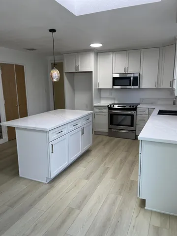 a bathroom with a double vanity sink and mirror