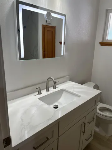 a view of a dry yard with a snow in the yard