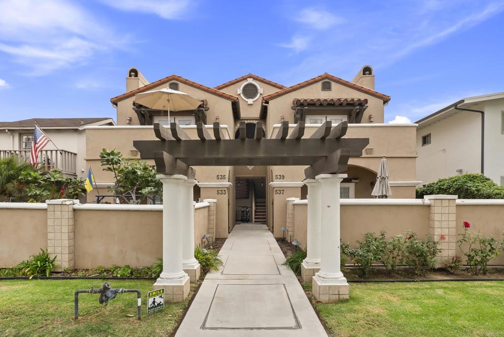 535 F Avenue, Unit 4 Coronado, CA 92118 - Photo 1 of 48 a front view of a house with garden