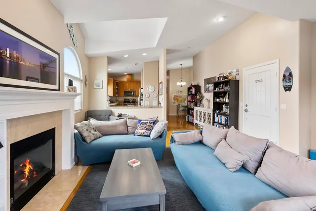 a view of a dining room with furniture wooden floor and a chandelier