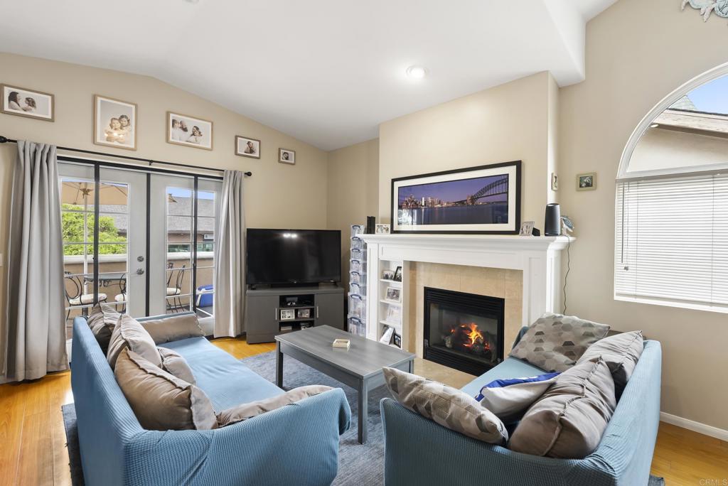 535 F Avenue, Unit 4 Coronado, CA 92118 - Photo 12 of 48 a living room with furniture a fireplace and a flat screen tv