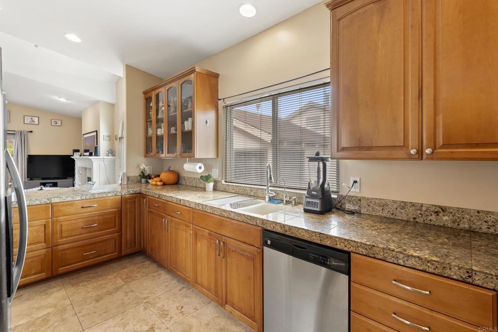 535 F Avenue, Unit 4 Coronado, CA 92118 - Photo 19 of 48 a kitchen with stainless steel appliances granite countertop a sink stove and cabinets