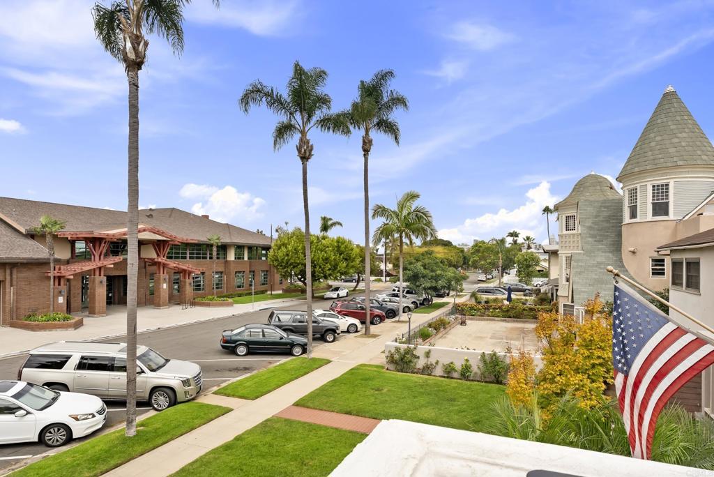 535 F Avenue, Unit 4 Coronado, CA 92118 - Photo 24 of 48 a view of a swimming pool with lawn chairs under an umbrella