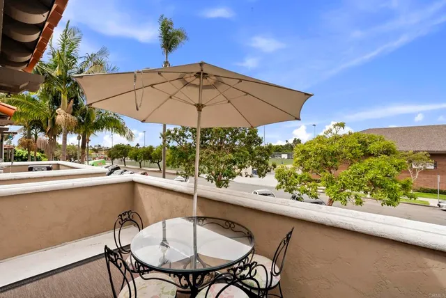a bathroom with double vanity sinks a large mirror and a shower