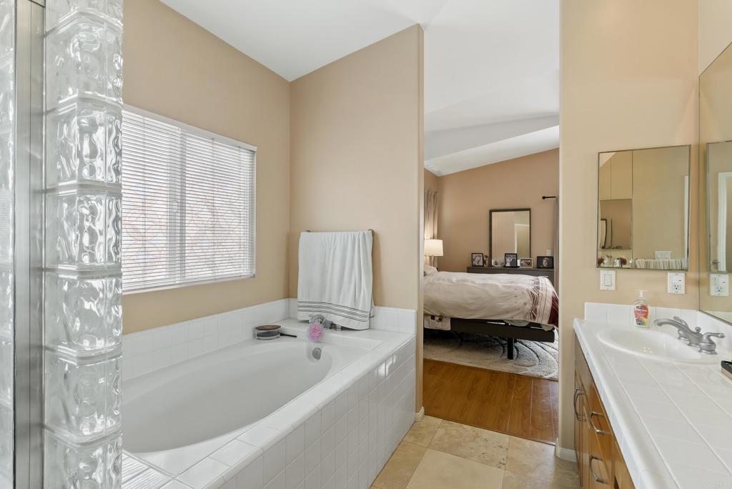 535 F Avenue, Unit 4 Coronado, CA 92118 - Photo 35 of 48 a en suite bathroom with a tub double vanity and window