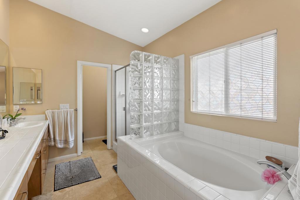 535 F Avenue, Unit 4 Coronado, CA 92118 - Photo 37 of 48 a spacious bathroom with sink shower and bathtub