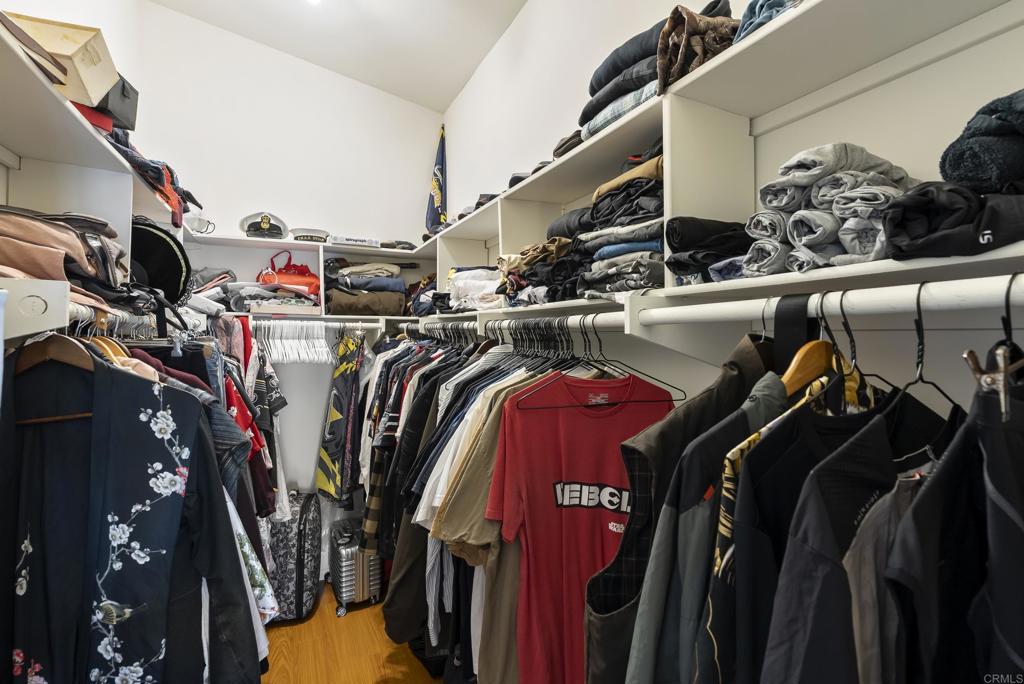 535 F Avenue, Unit 4 Coronado, CA 92118 - Photo 38 of 48 a view of walk in closet with clothes and shoes