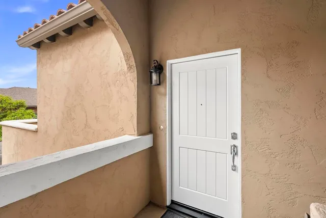 an aerial view of a house with a yard basket ball court and outdoor seating