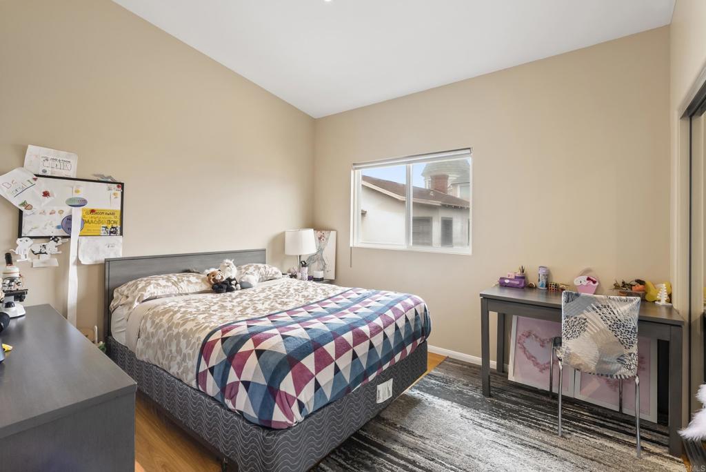 535 F Avenue, Unit 4 Coronado, CA 92118 - Photo 42 of 48 a bedroom with a bed and dresser