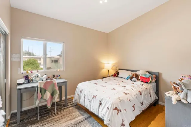 a spacious bathroom with a granite countertop sink a bathtub and next to a window