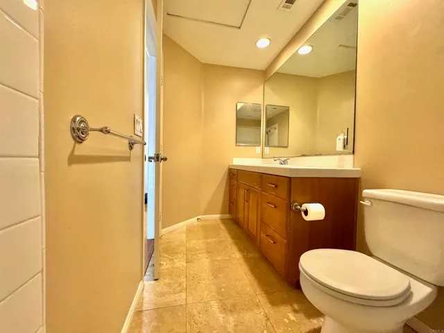 a kitchen with refrigerator and window