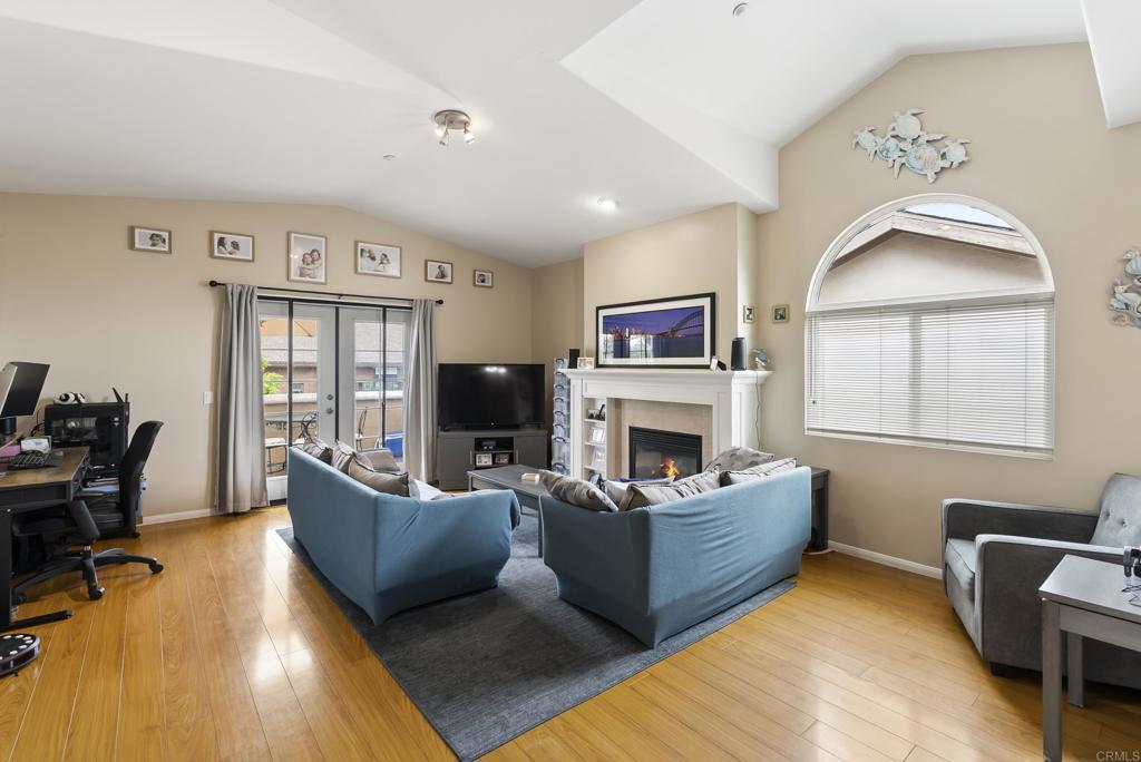 535 F Avenue, Unit 4 Coronado, CA 92118 - Photo 10 of 48 a living room with furniture fireplace and a flat screen tv
