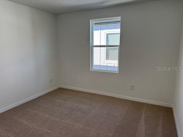 17727 Sharp Pummelo Alley Winter Garden, FL 34787 - Photo 12 of 19 an empty room with a window